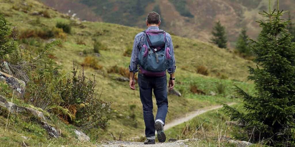 guy carrying backpack