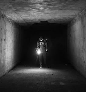man holding flashlight